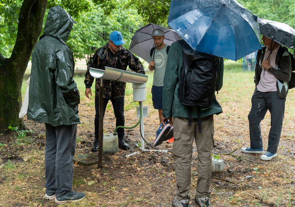 _SON1530 Team members are observing rainfall measurment unit.